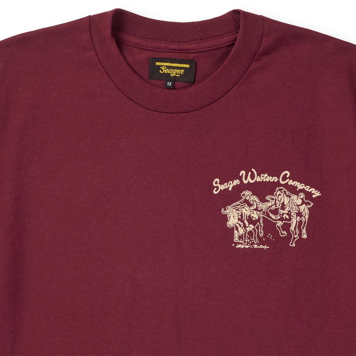 Maroon t-shirt with Seeger Western Company logo on a white background