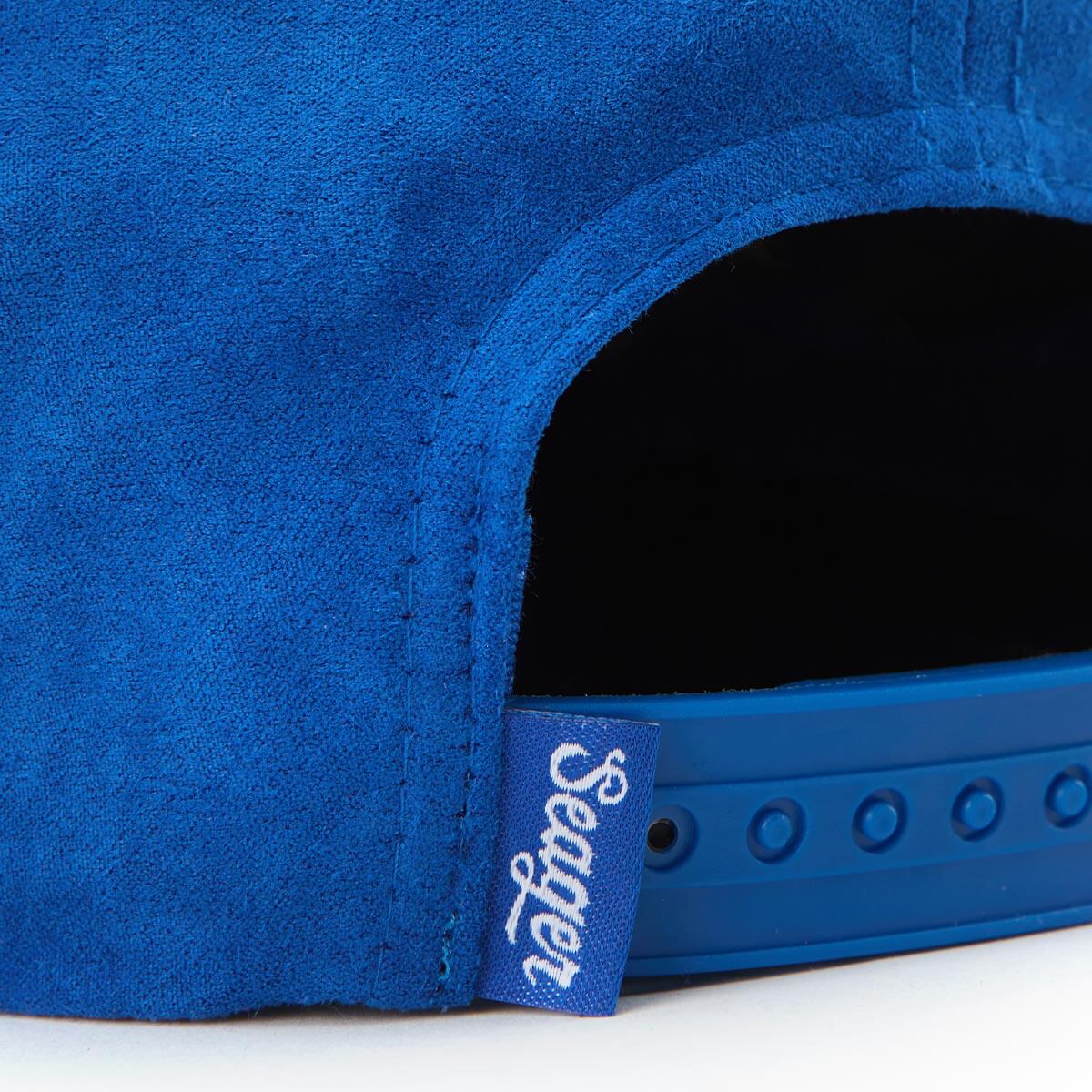 Blue hat with a visible brand tag on a white background