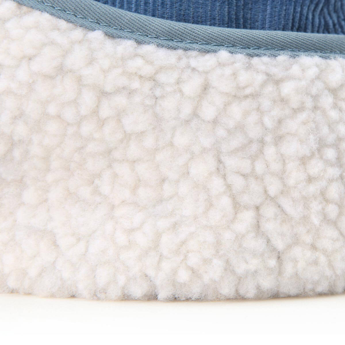 Close-up of a textured fabric with a blue border