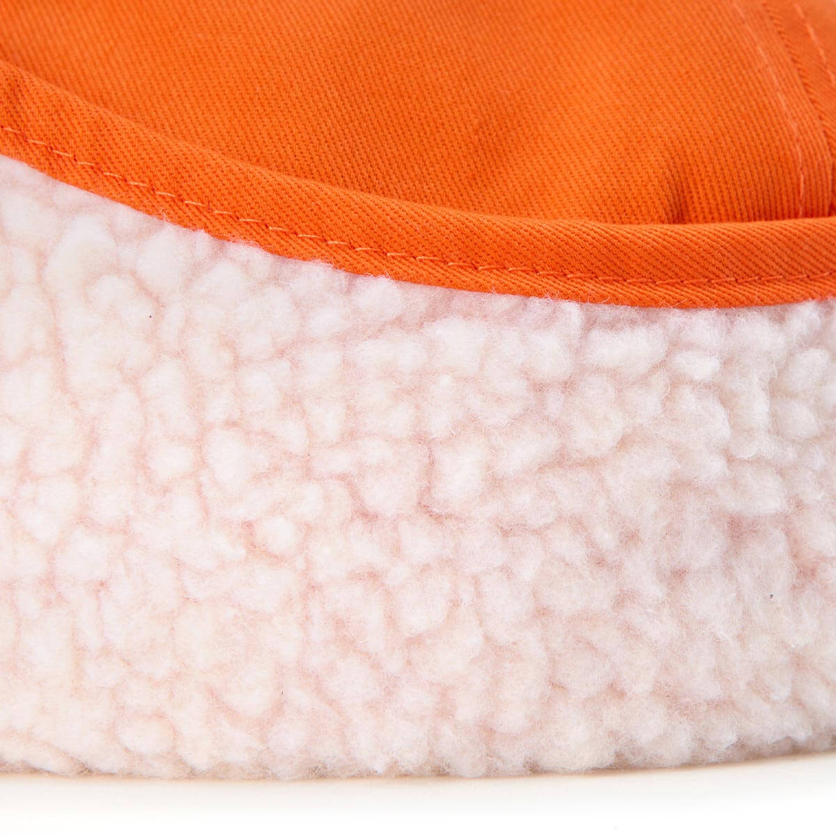 Close-up of an orange and white fleece fabric