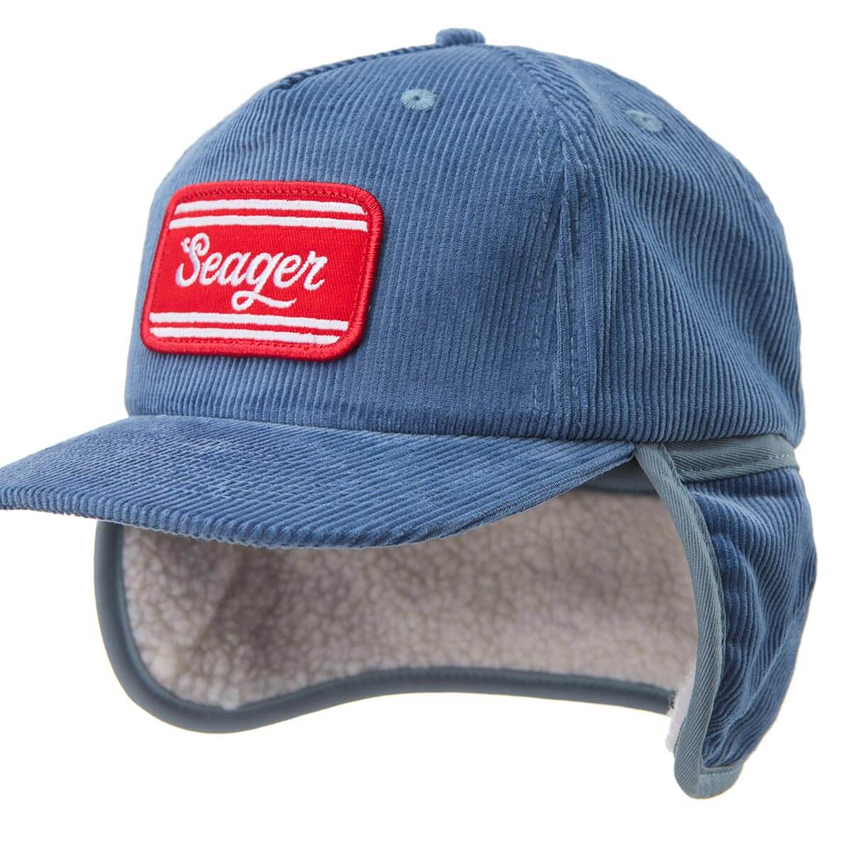 Blue corduroy cap with a red and white 'Seager' patch on a white background